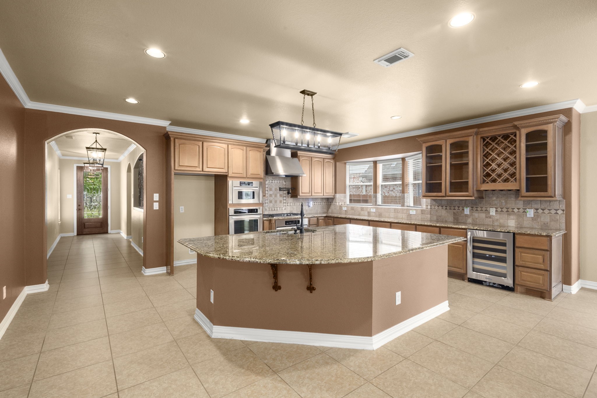 110 David Forest Lane Conroe, TX 77384 - Photo 14 of 35 an open kitchen with granite countertop a stove and cabinets