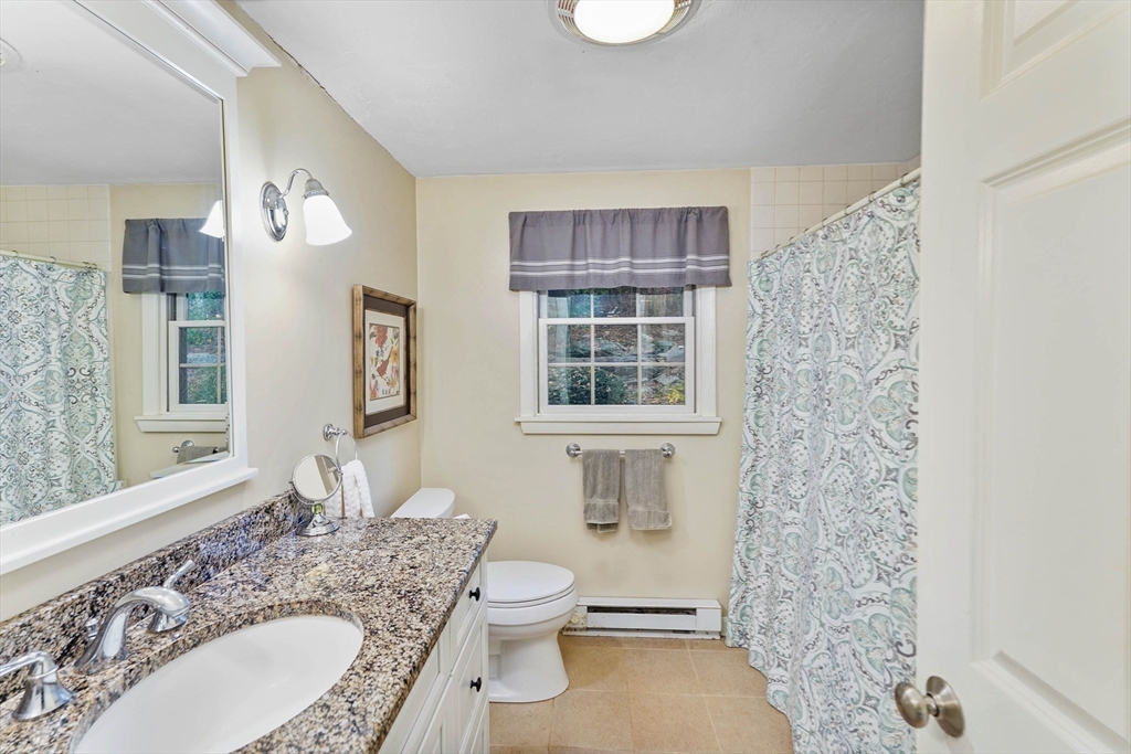 40 Breakneck Road Sturbridge, MA 01566 - Photo 21 of 39 a bathroom with a granite countertop sink toilet and shower
