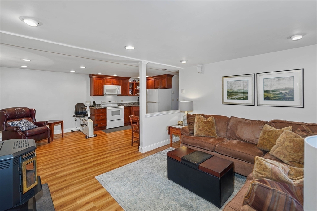 40 Breakneck Road Sturbridge, MA 01566 - Photo 24 of 39 a living room with furniture and a wooden floor