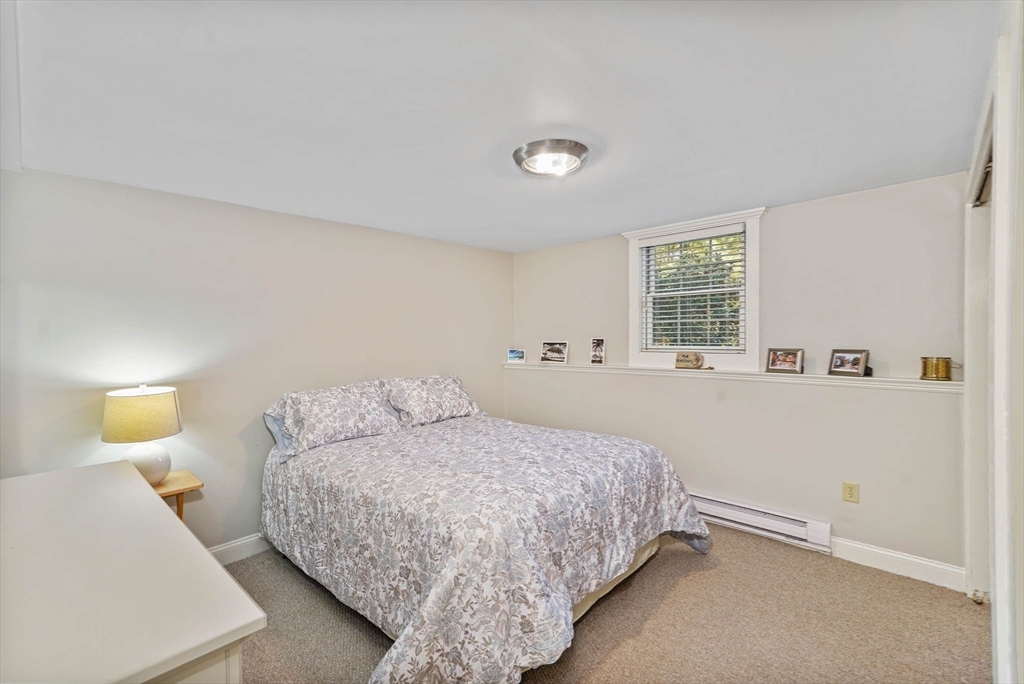40 Breakneck Road Sturbridge, MA 01566 - Photo 27 of 39 a bedroom with a bed and window
