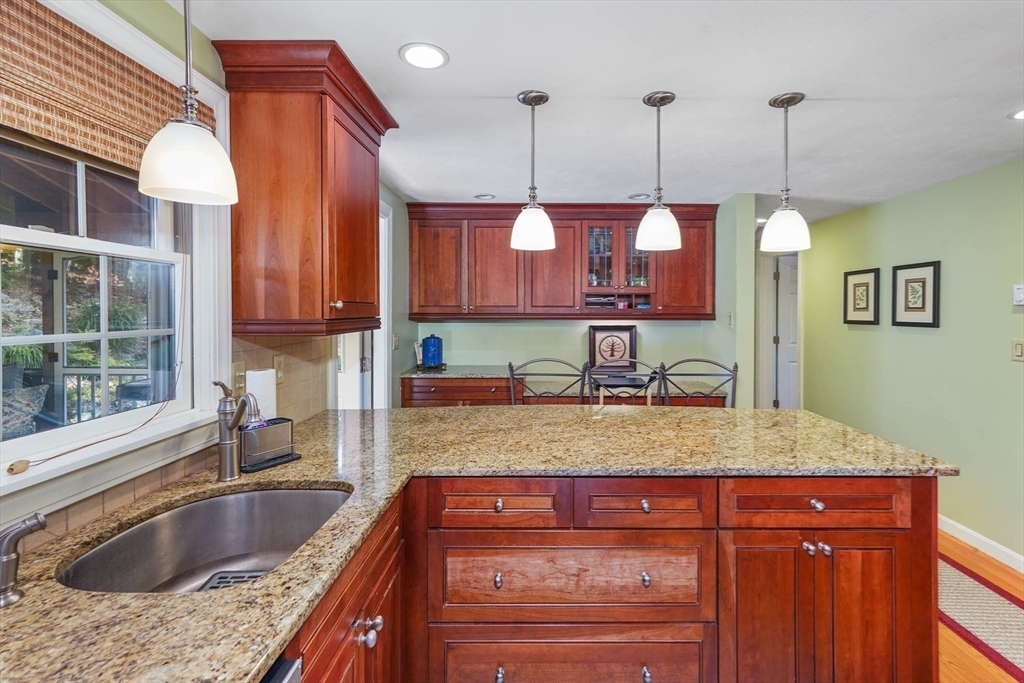 40 Breakneck Road Sturbridge, MA 01566 - Photo 8 of 39 a kitchen with a sink a counter and cabinets