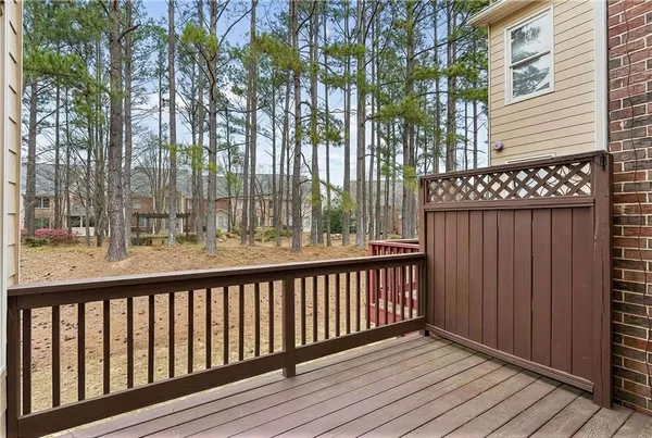 a view of balcony with wooden floor