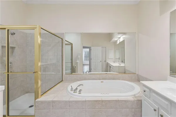 a bathroom with a bathtub and a sink