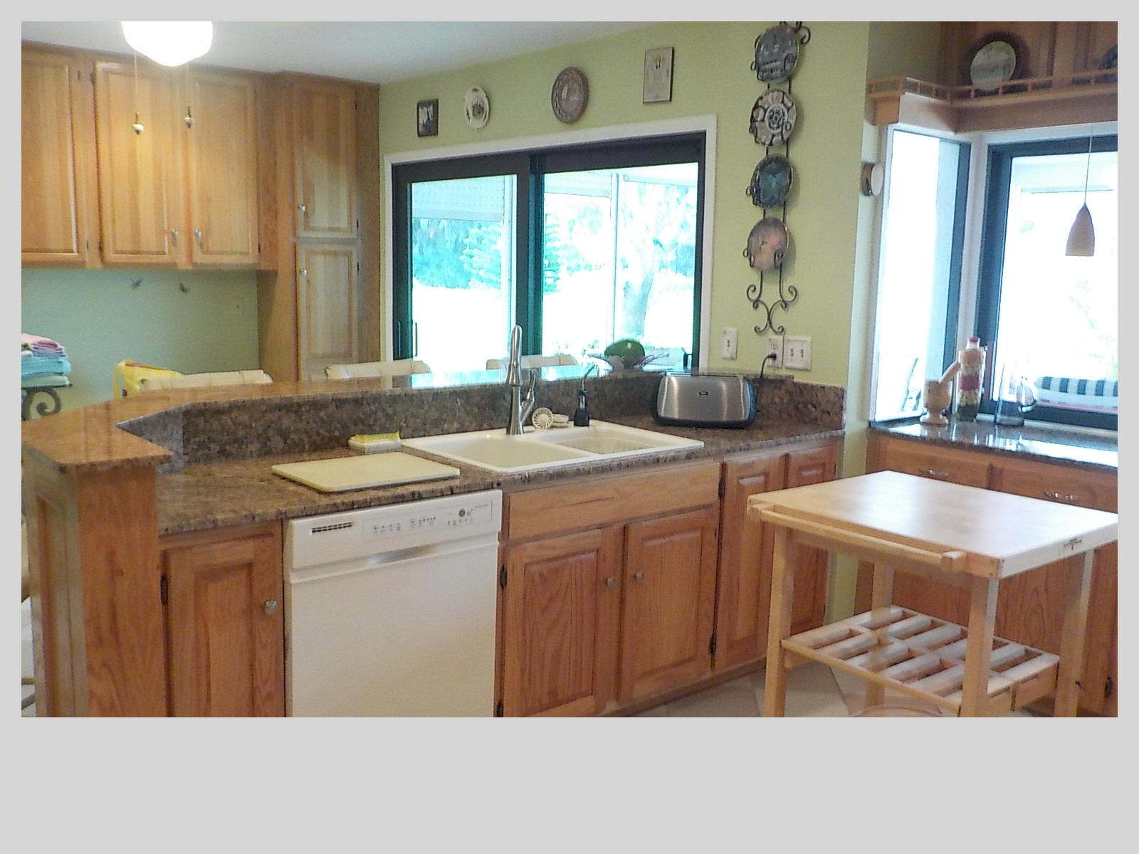 2159 Southeast Erwin Road Port St. Lucie, FL 34952 - Photo 8 of 48 a kitchen with a sink stove and cabinets