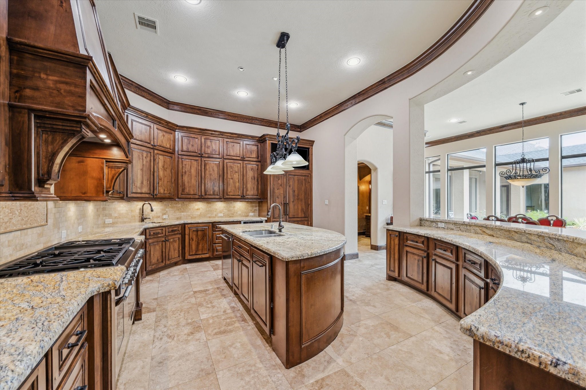 a kitchen that has a lot of cabinets in it