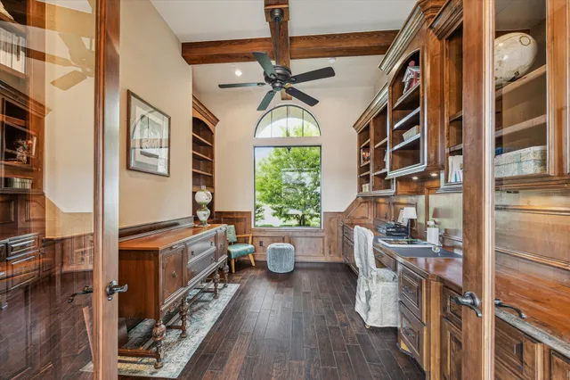 a very nice looking room with a large window and wooden floor