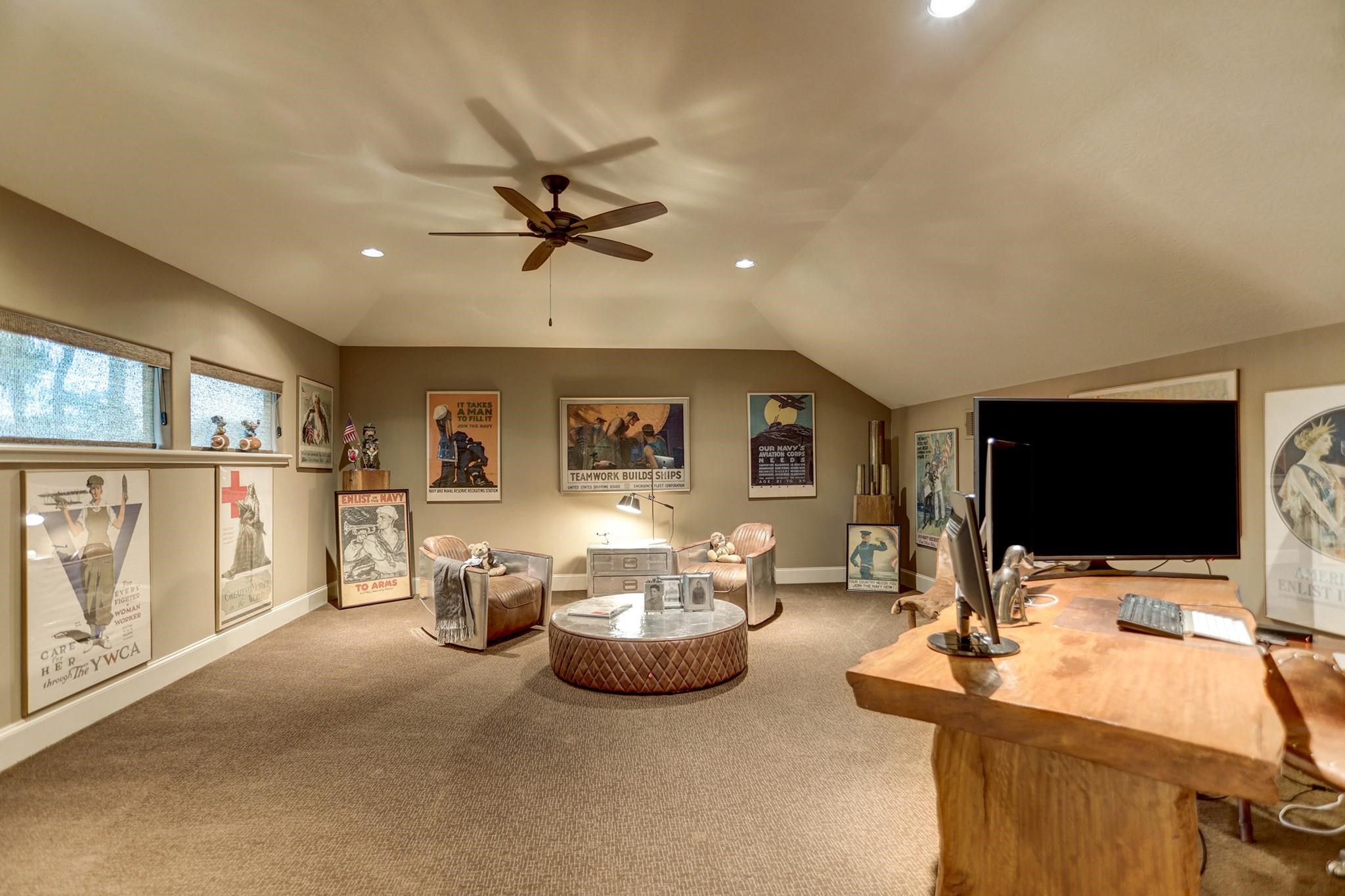 7611 Morgans Pond Court Spring, TX 77389 - Photo 13 of 50 a living room with furniture a flat screen tv and a large window