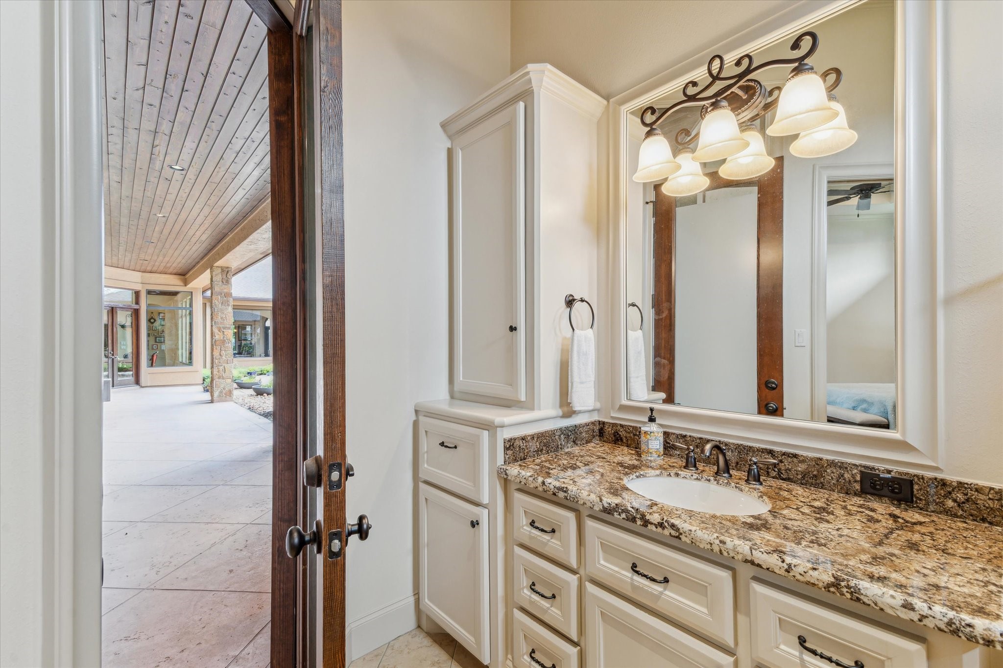 7611 Morgans Pond Court Spring, TX 77389 - Photo 22 of 50 a bathroom with a granite countertop sink mirror and a shower