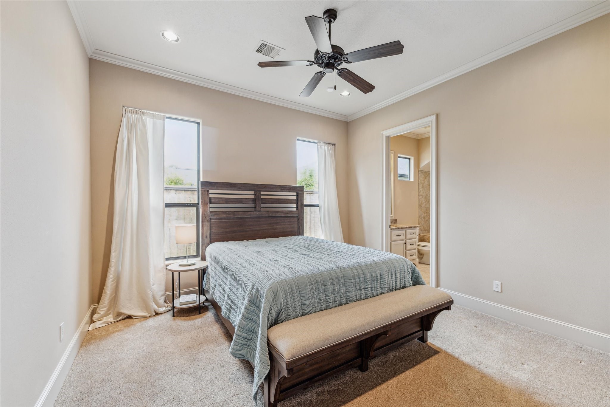 7611 Morgans Pond Court Spring, TX 77389 - Photo 23 of 50 a bedroom with a bed and a chandelier