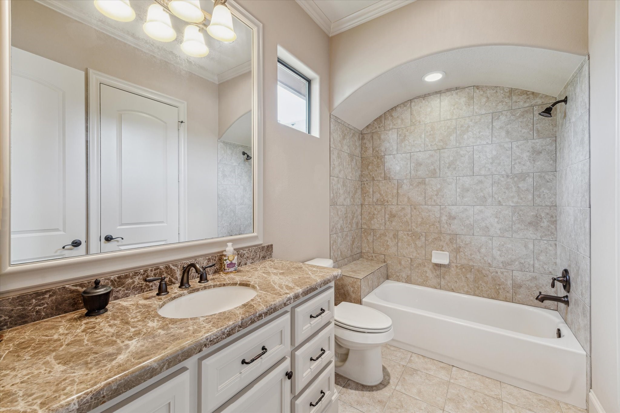7611 Morgans Pond Court Spring, TX 77389 - Photo 24 of 50 a bathroom with a granite countertop sink a toilet and bathtub