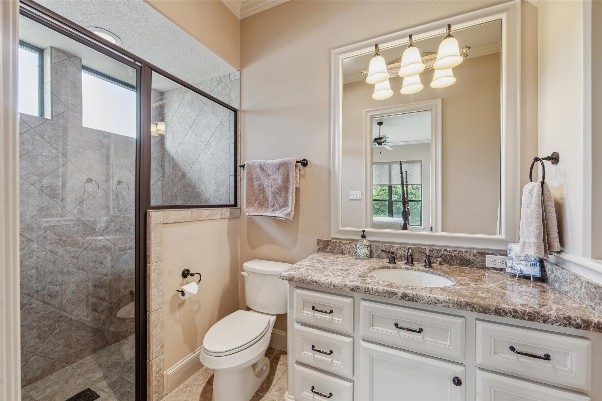 7611 Morgans Pond Court Spring, TX 77389 - Photo 26 of 50 a bathroom with a granite countertop sink toilet and shower