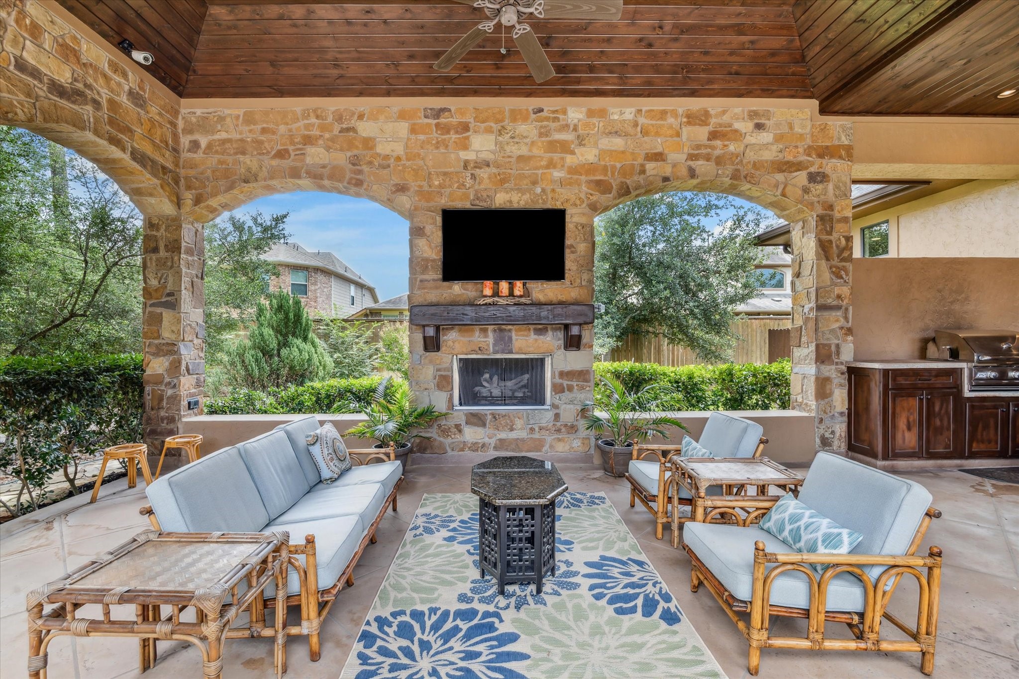 7611 Morgans Pond Court Spring, TX 77389 - Photo 37 of 50 a outdoor space with patio fireplace couches and a fireplace with the potted plants