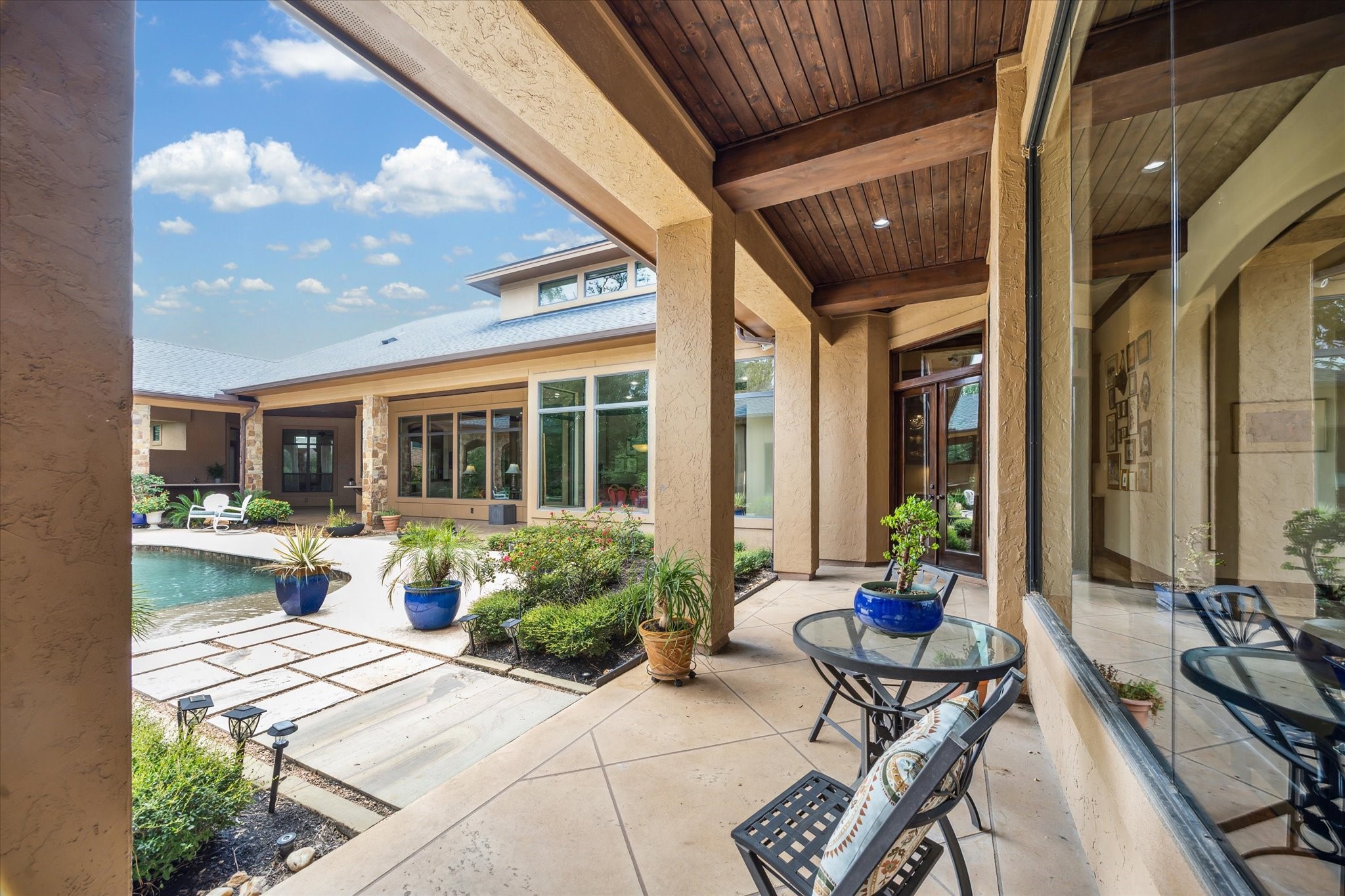 7611 Morgans Pond Court Spring, TX 77389 - Photo 40 of 50 a view of a patio with chairs and potted plants