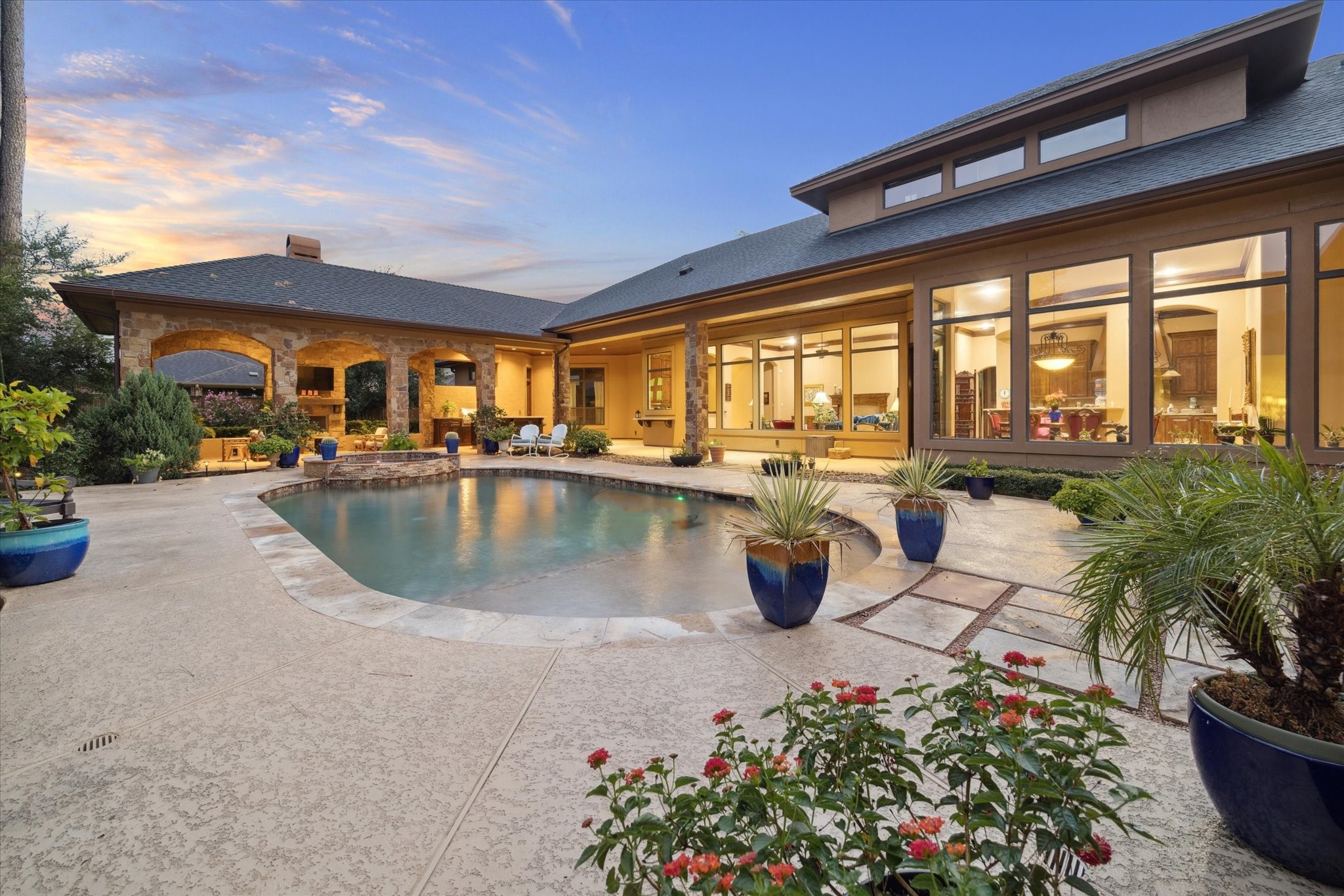 7611 Morgans Pond Court Spring, TX 77389 - Photo 4 of 50 a view of a swimming pool with outdoor seating and plants