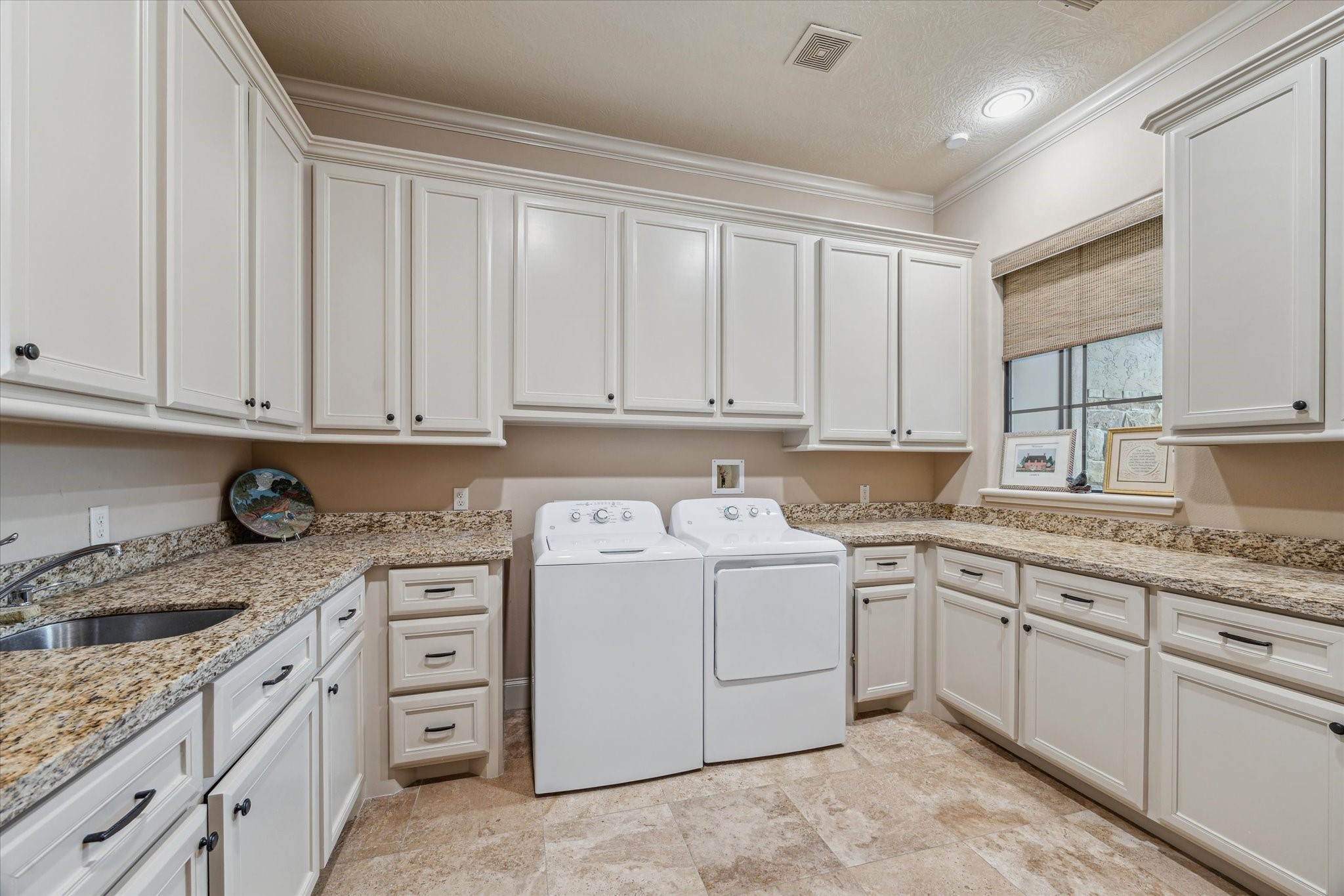 7611 Morgans Pond Court Spring, TX 77389 - Photo 47 of 50 a kitchen with cabinets appliances a sink and a counter top space