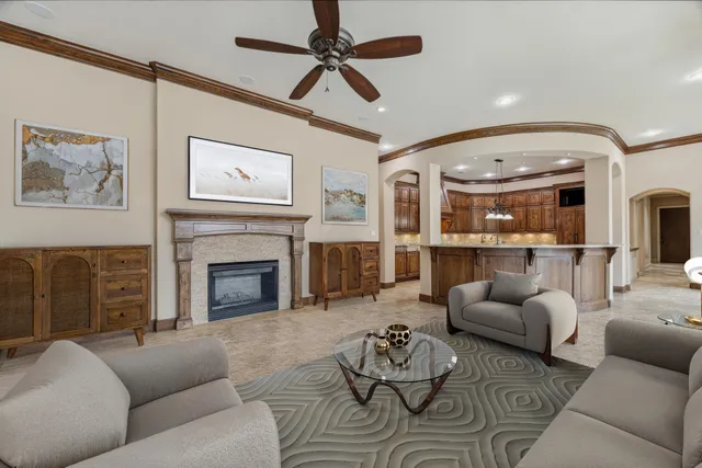 a living room with furniture and a fireplace