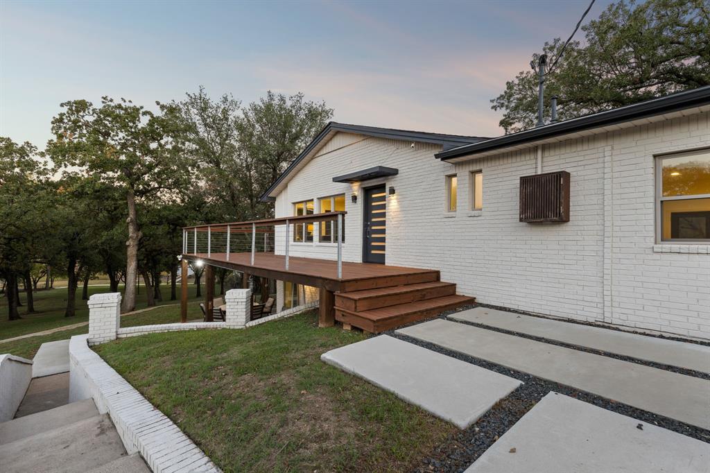 7342 Briar Road Azle, TX 76020 - Photo 26 of 40 Entrance to the house and outdoor access to the lower patios