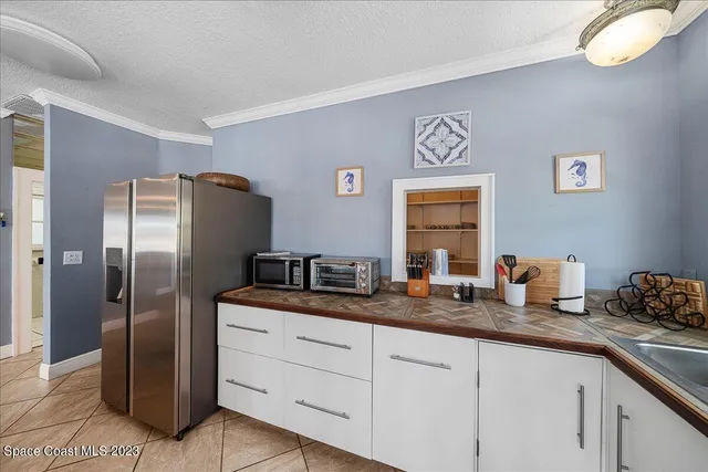 a kitchen with stainless steel appliances granite countertop a stove and cabinets
