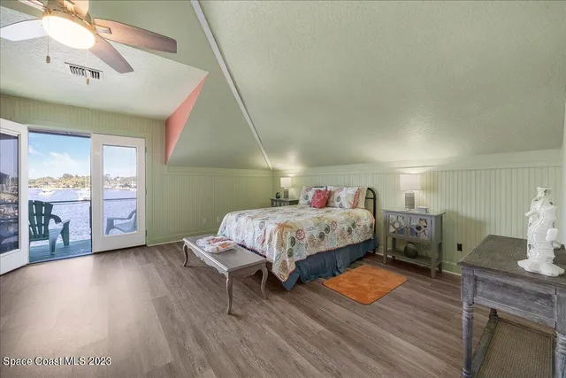 a bedroom with a bed and a table