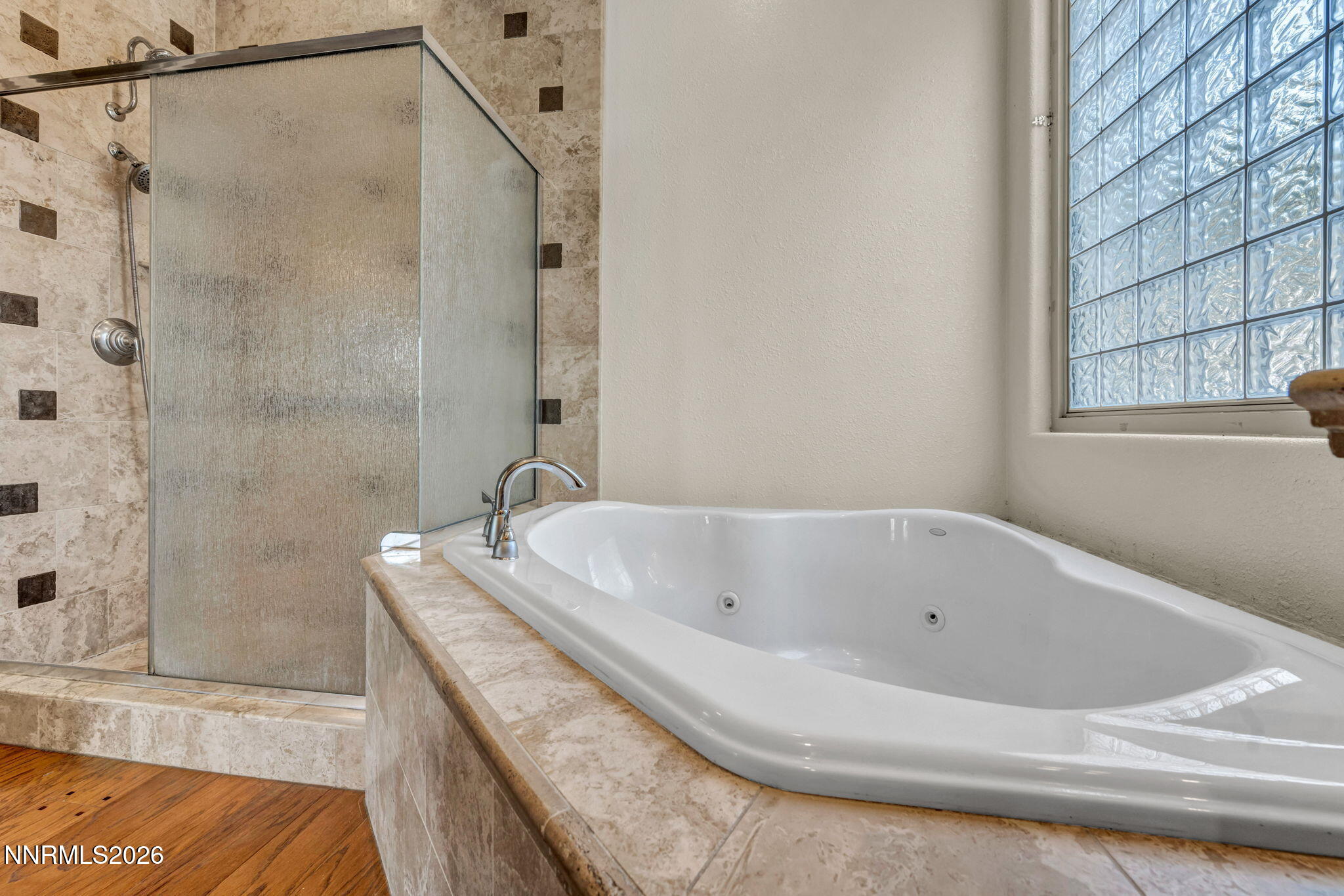 9900 Wilbur May Parkway, Unit 2801 Reno, NV 89521 - Photo 35 of 70 a bathroom with a tub and a shower