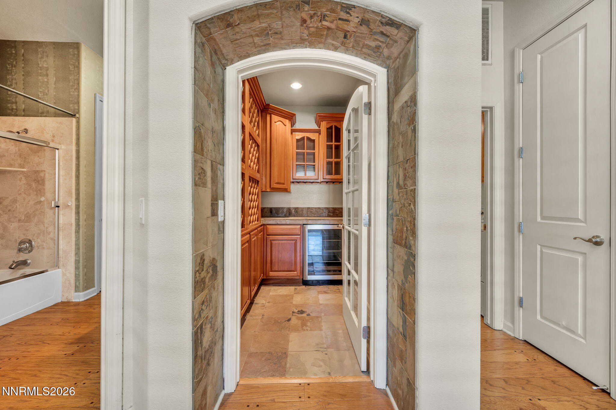 9900 Wilbur May Parkway, Unit 2801 Reno, NV 89521 - Photo 44 of 70 a view of a hallway with wooden floor and a living room