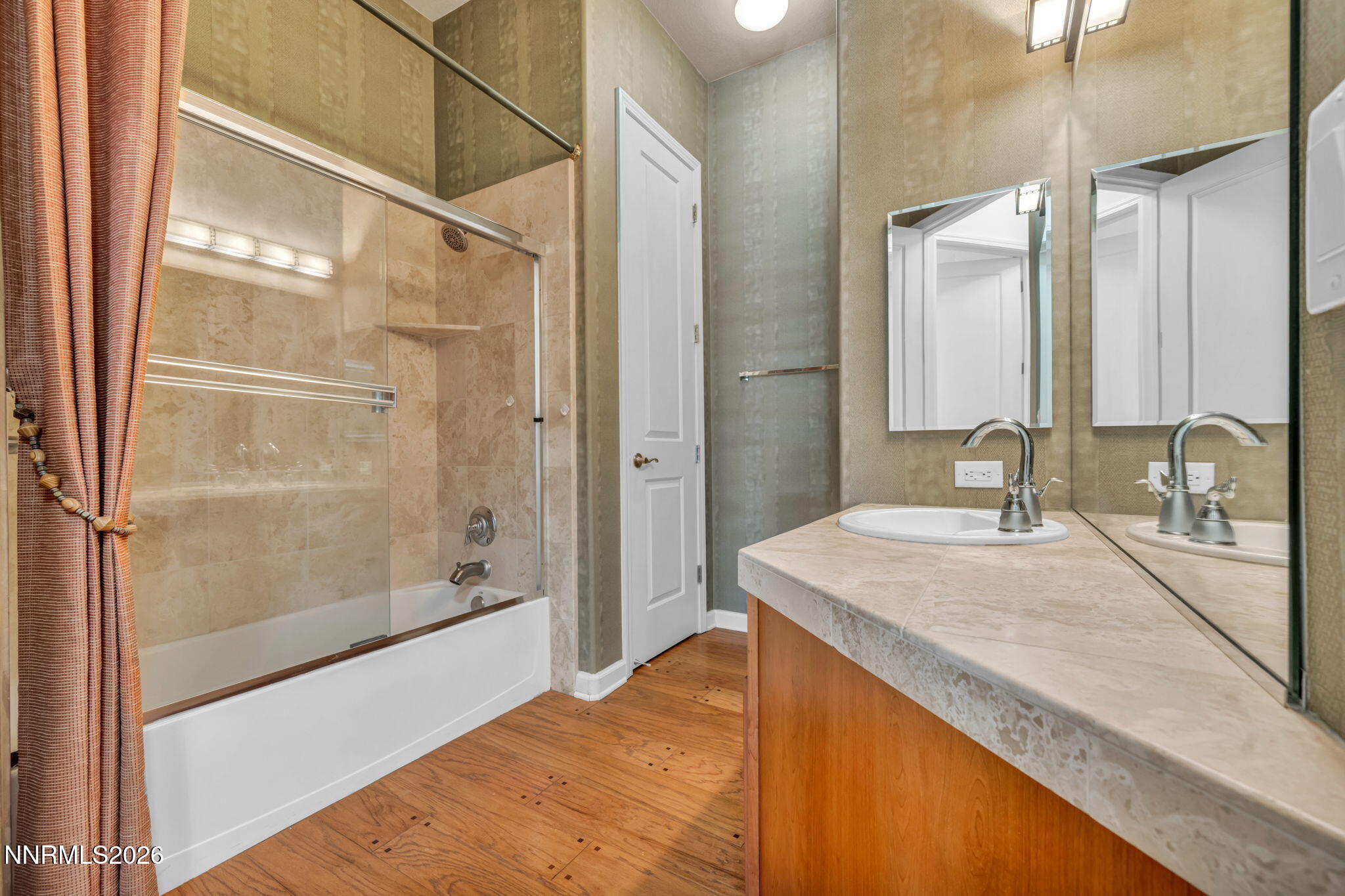 9900 Wilbur May Parkway, Unit 2801 Reno, NV 89521 - Photo 46 of 70 a bathroom with a sink and a mirror with bathtub