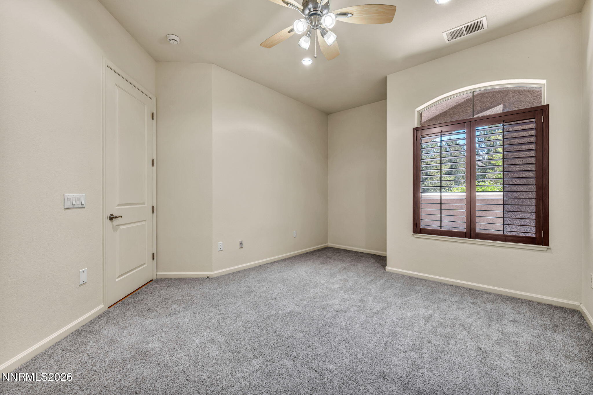 9900 Wilbur May Parkway, Unit 2801 Reno, NV 89521 - Photo 50 of 70 an empty room with chandelier fan and windows
