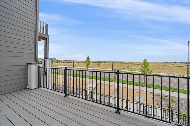 a view of balcony with wooden floor