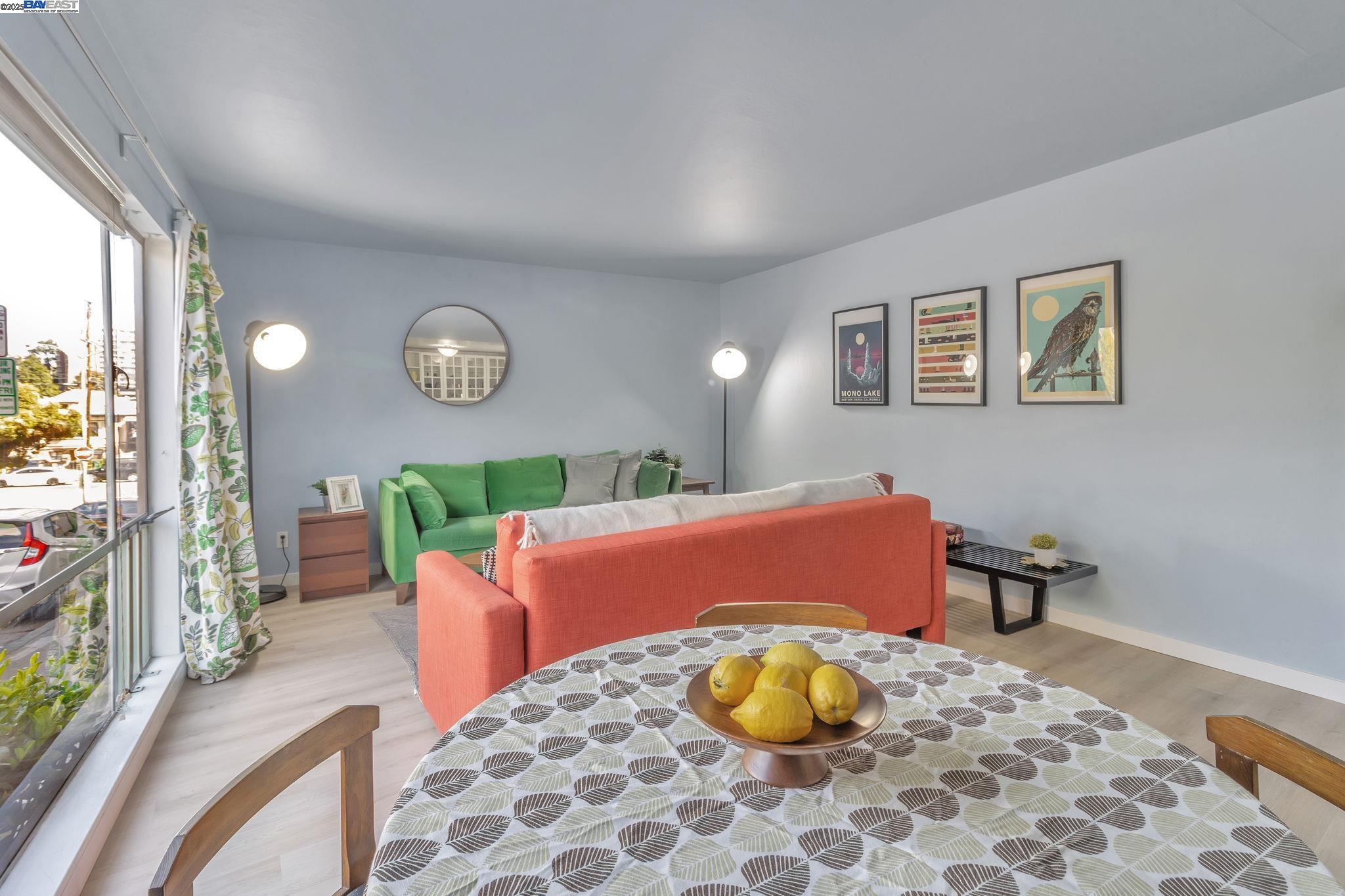 3877 Howe Street, Unit 106 Oakland, CA 94611 - Photo 8 of 17 a living room with furniture and a window