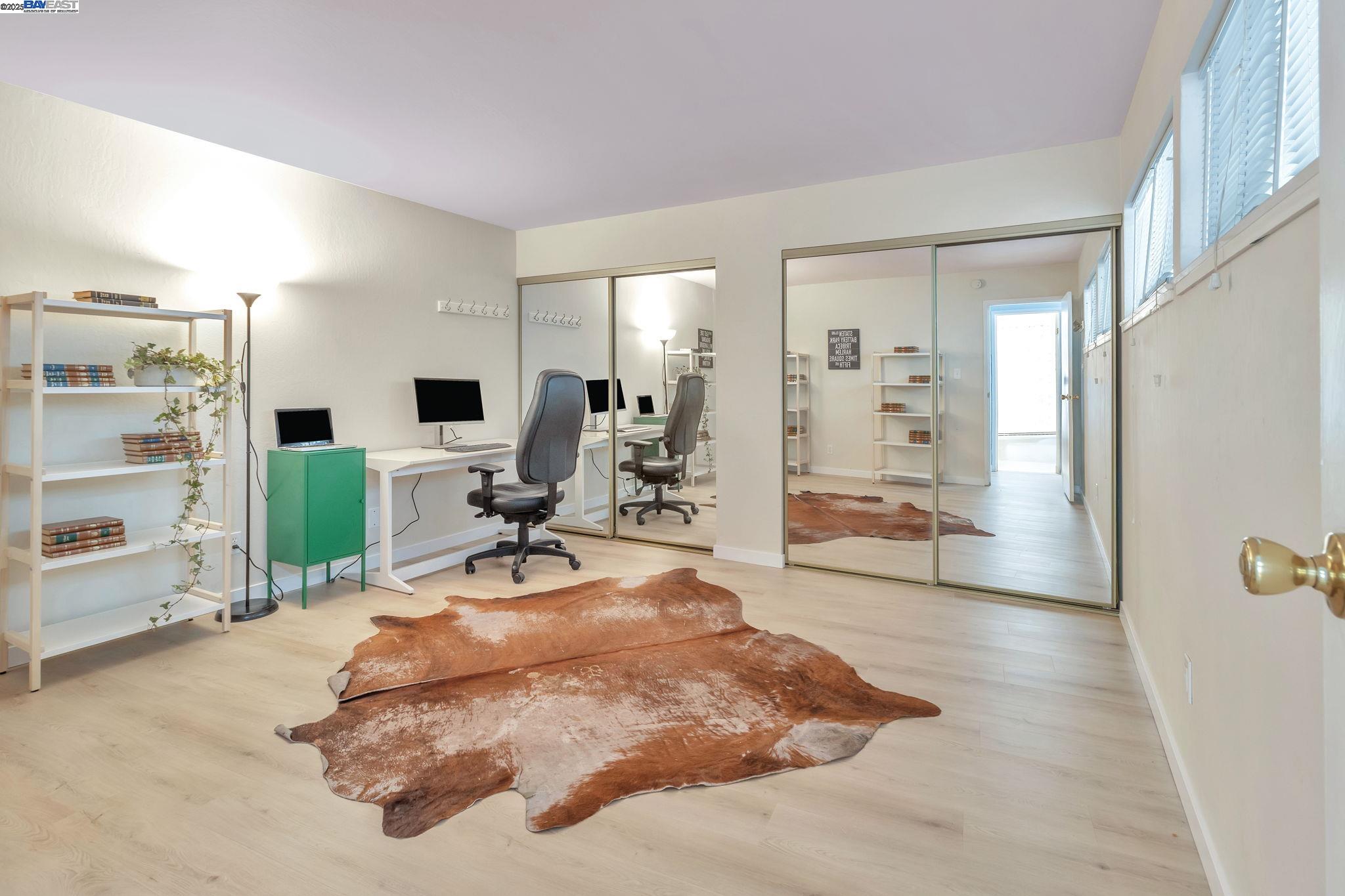 3877 Howe Street, Unit 106 Oakland, CA 94611 - Photo 9 of 17 a view of a livingroom with furniture and a large window