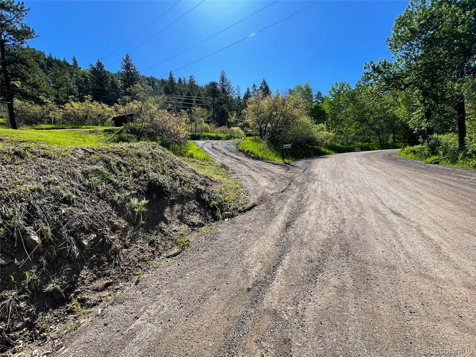 Lot 2 South Maxwell Hill Road Littleton, CO 80127 - Photo 11 of 29 a view of a road with a yard