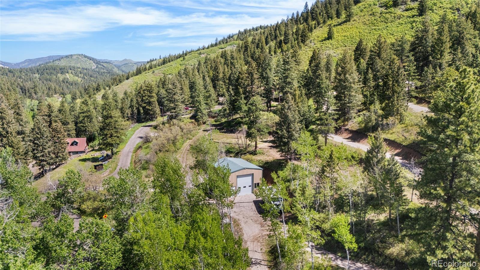 Lot 2 South Maxwell Hill Road Littleton, CO 80127 - Photo 7 of 29 a view of a city with lush green forest