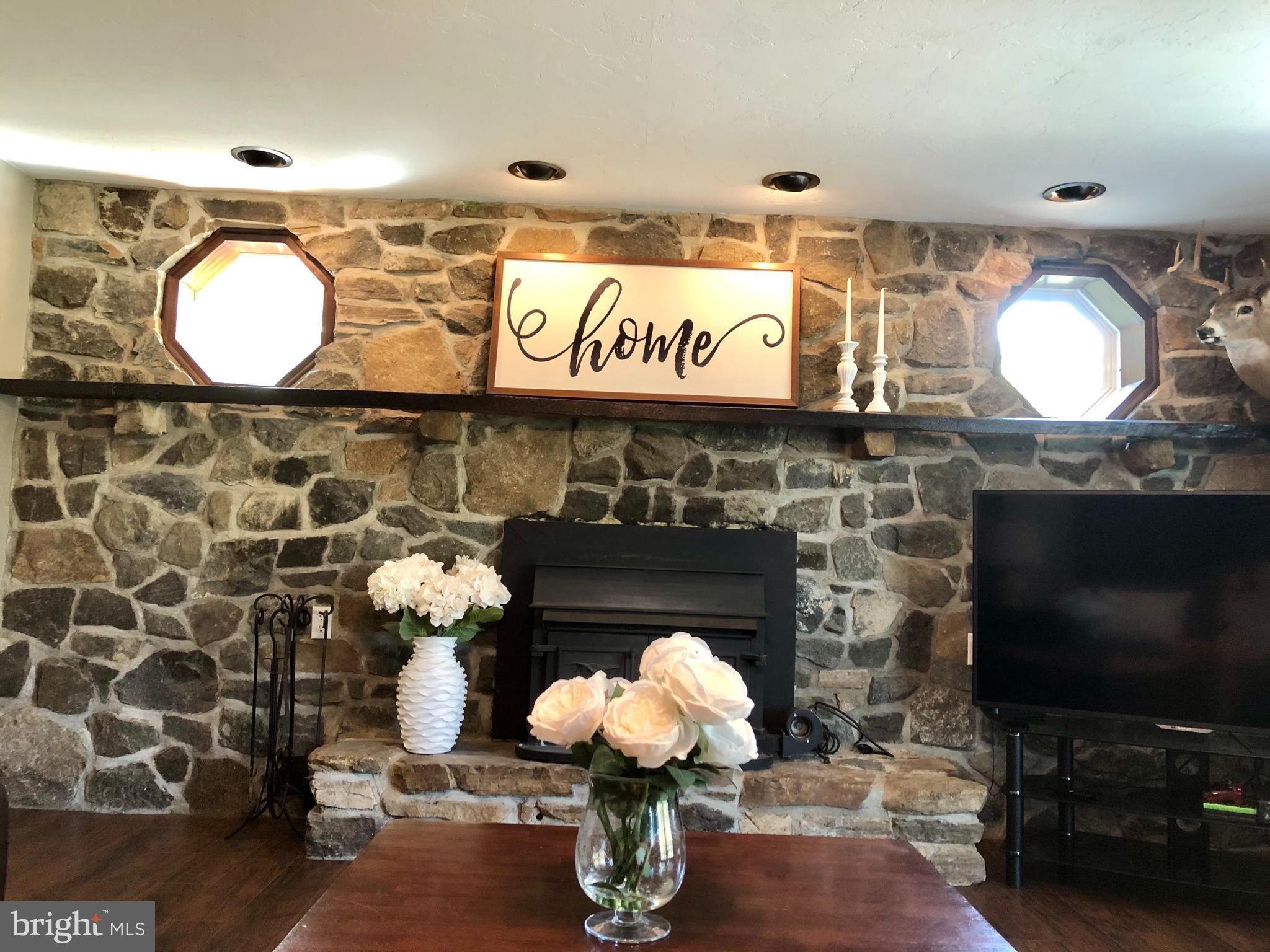 59 Steelman Marker Road Fairfield, PA 17320 - Photo 34 of 95 Wood stove with beautiful stone finishes