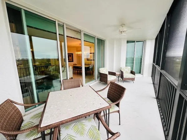 a view of a dining room with furniture window and outside view