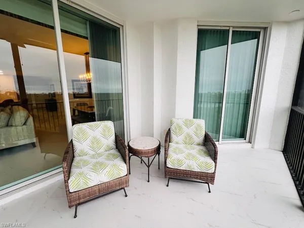 a bedroom with furniture and window
