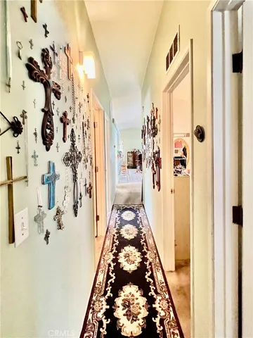 a kitchen with a refrigerator and a stove
