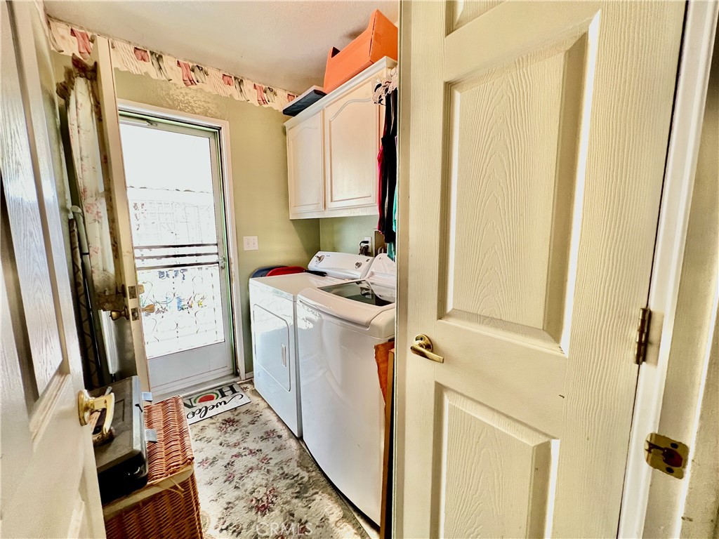 9391 California Avenue, Unit 97 Riverside, CA 92503 - Photo 14 of 21 a kitchen with a refrigerator and a stove