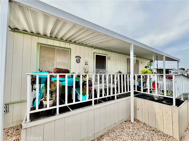 a room with lots of white wooden floor and white walls