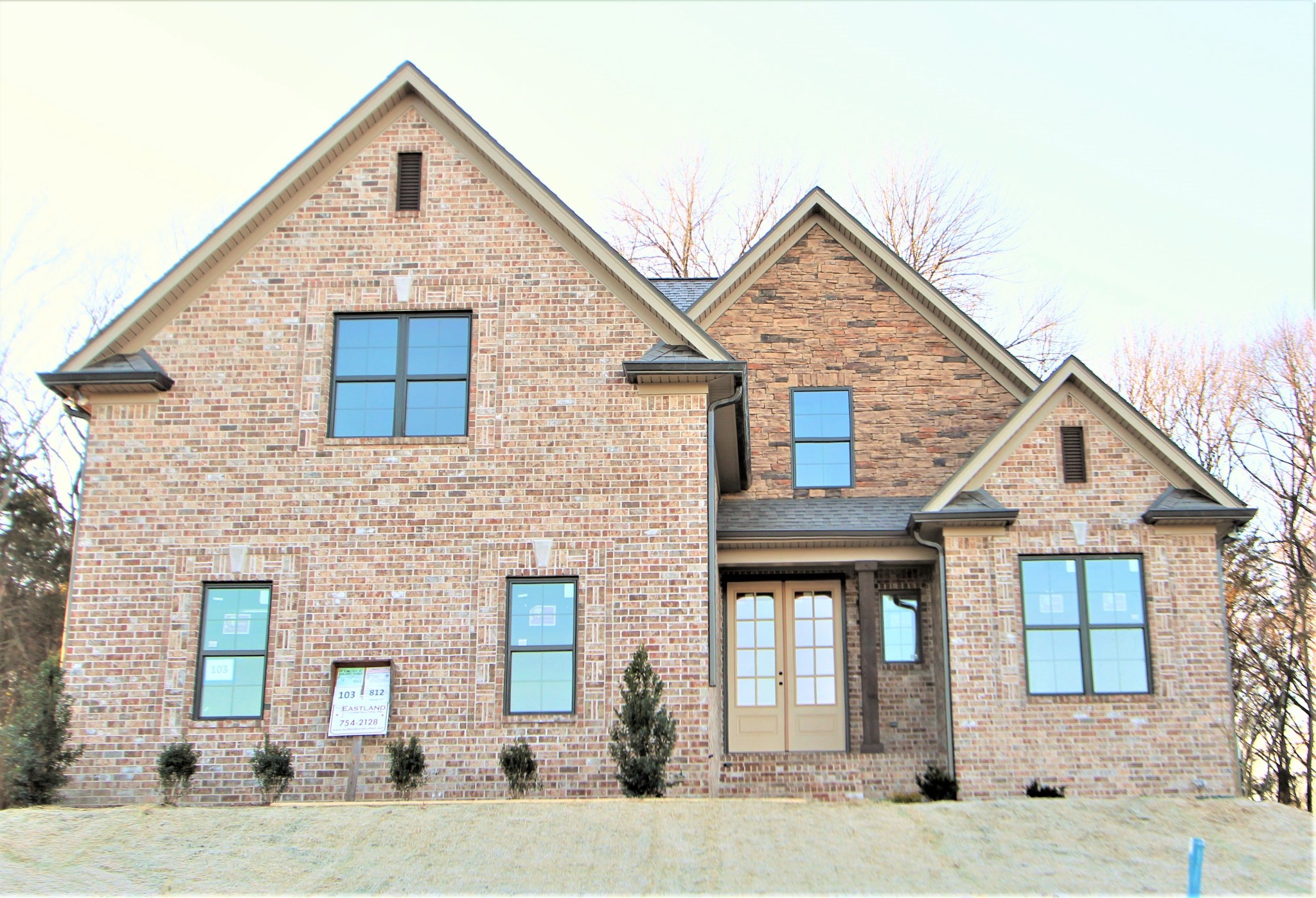 812 Ridgestone Place, Unit 103 Lebanon, TN 37087 - Photo 1 of 24 a front view of a house with a yard