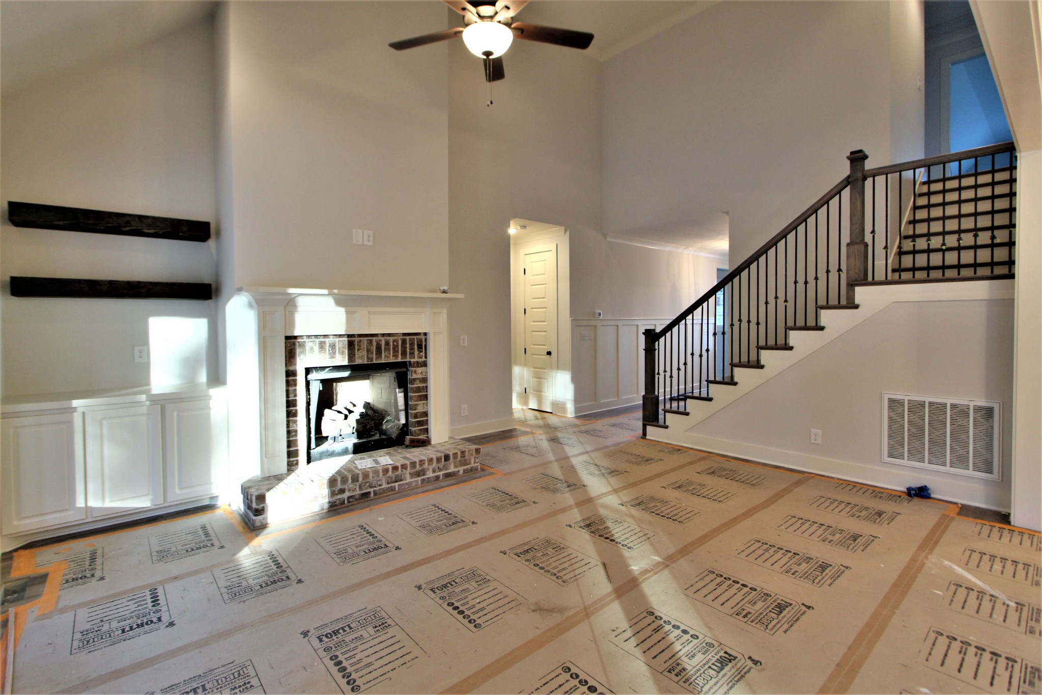 812 Ridgestone Place, Unit 103 Lebanon, TN 37087 - Photo 2 of 24 a view of a hallway with a white walls and chandelier