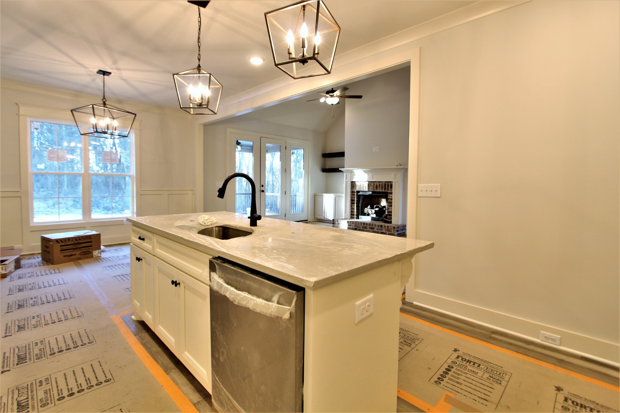 812 Ridgestone Place, Unit 103 Lebanon, TN 37087 - Photo 12 of 24 a kitchen with a sink and a refrigerator