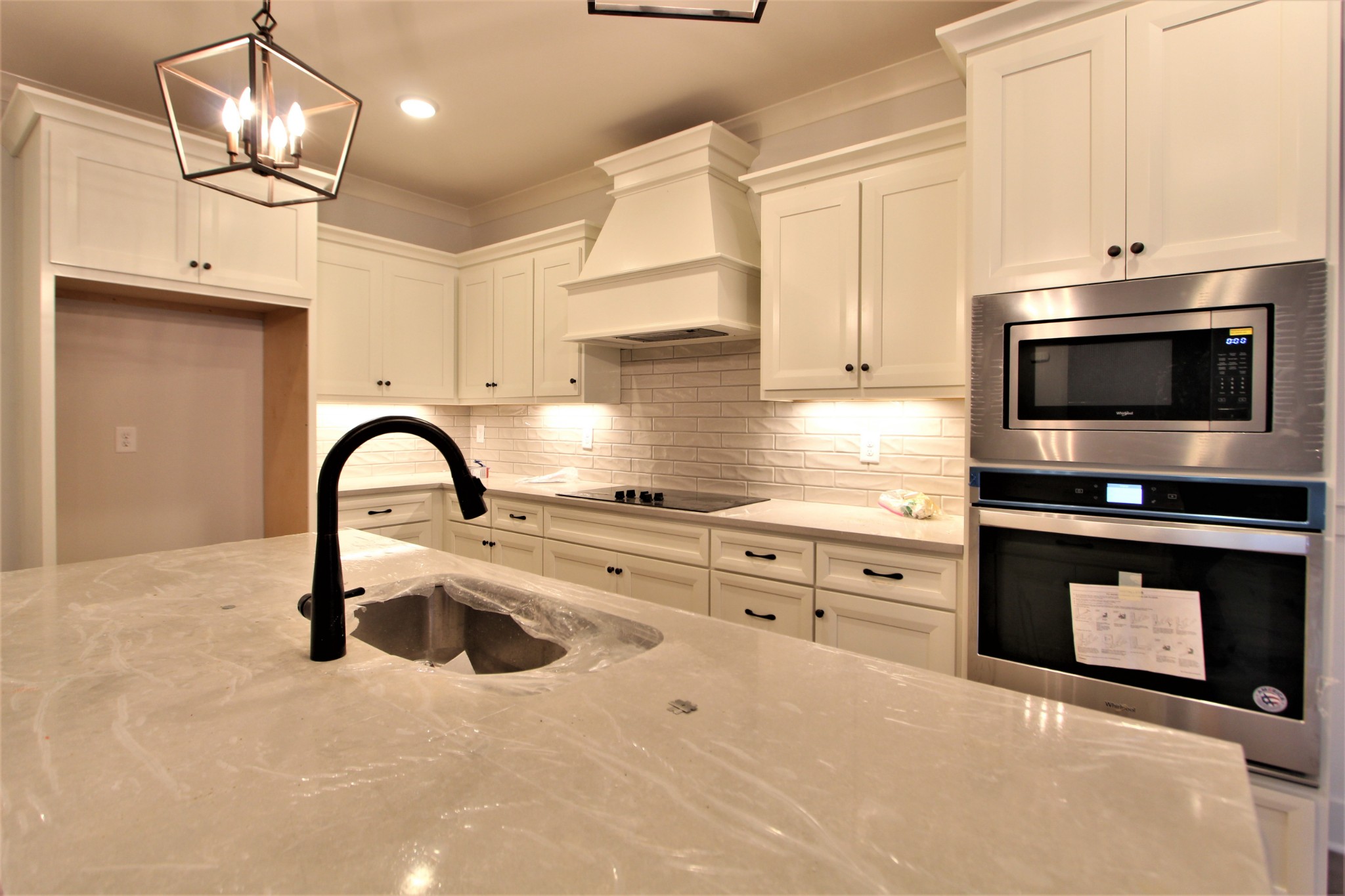 812 Ridgestone Place, Unit 103 Lebanon, TN 37087 - Photo 13 of 24 a kitchen with stainless steel appliances a stove sink and cabinets