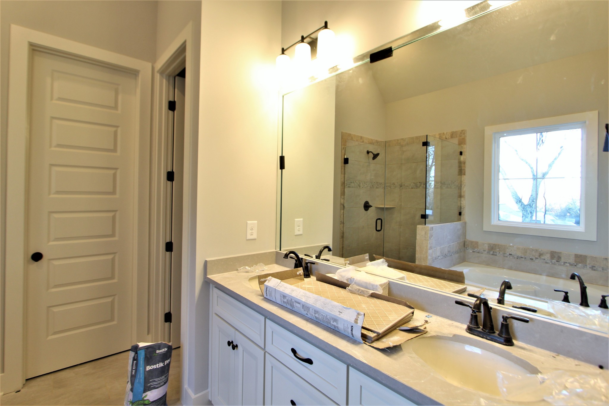 812 Ridgestone Place, Unit 103 Lebanon, TN 37087 - Photo 16 of 24 a bathroom with a granite countertop sink mirror and double