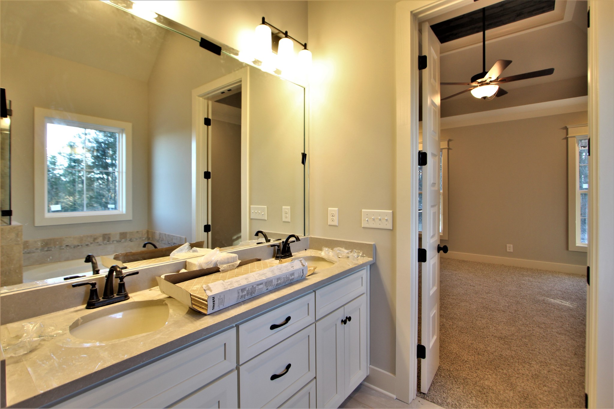 812 Ridgestone Place, Unit 103 Lebanon, TN 37087 - Photo 17 of 24 a bathroom with a granite countertop sink mirror and double