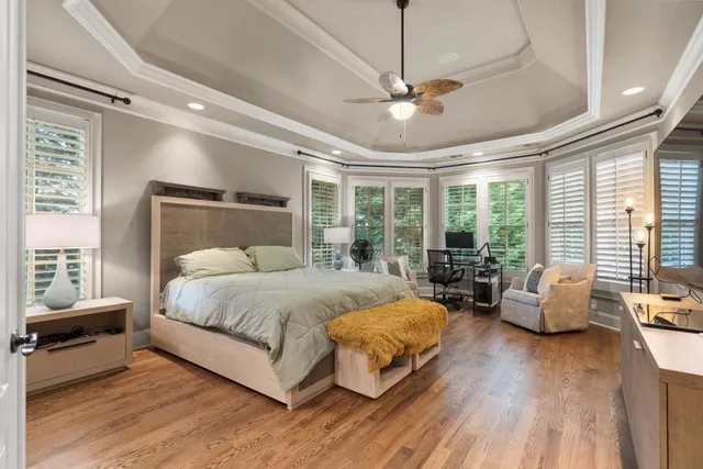a balcony with furniture and wooden floor