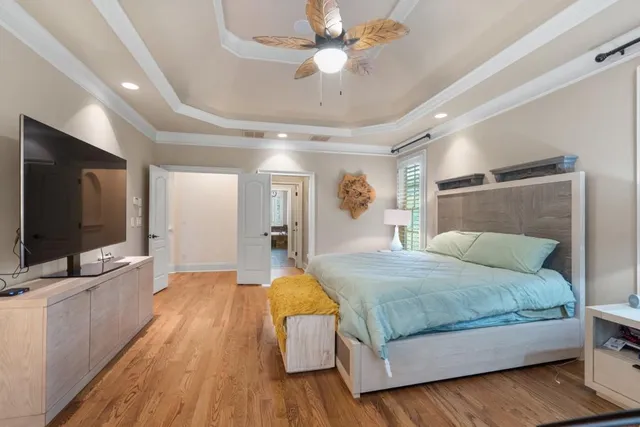 a kitchen with stainless steel appliances granite countertop a sink a stove and a wooden cabinets