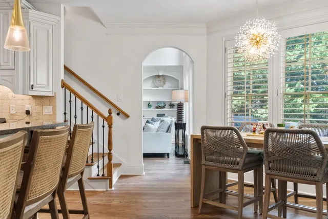 a view of a balcony with furniture and wooden floor