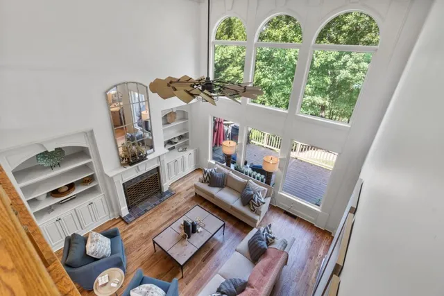 a living room with furniture and flat screen tv