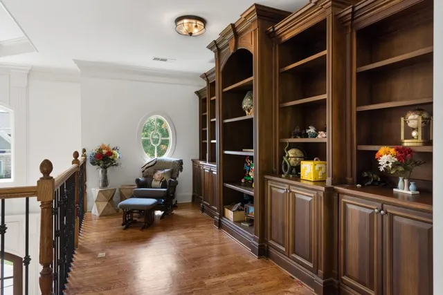 a bedroom with furniture and a flat screen tv