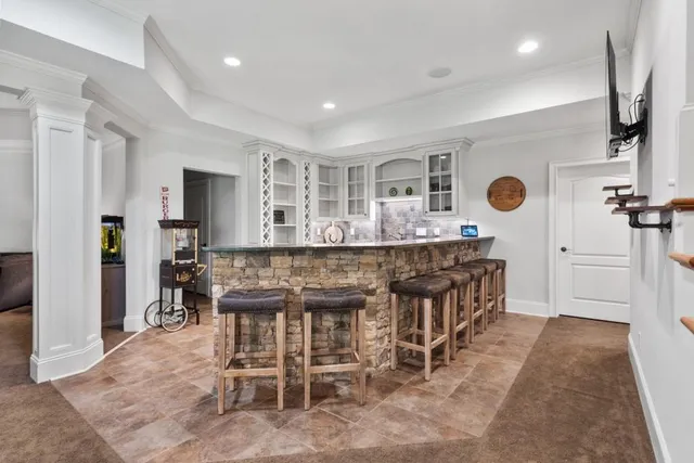 an aerial view of residential house with outdoor space and parking